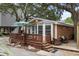 Exterior view of home featuring a wooden deck and stylish patio furniture at 6001 - 1040 S Kings Hwy., Myrtle Beach, SC 29575