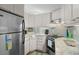 Well-lit kitchen offering light wood cabinetry, modern appliances, and a bright backsplash at 6001 - 1040 S Kings Hwy., Myrtle Beach, SC 29575
