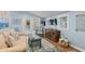 Bright living room featuring beachy accents, stylish furniture, and access to the outdoor deck at 6001 - 1040 S Kings Hwy., Myrtle Beach, SC 29575
