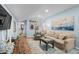 Bright living room featuring a plush couch, sea-themed decor, and pale blue walls at 6001 - 1040 S Kings Hwy., Myrtle Beach, SC 29575