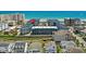 Aerial shot featuring the condo complex, highlighting its proximity to the beach and waterway, under a clear blue sky at 6001 N Ocean Blvd. # 137, North Myrtle Beach, SC 29582