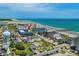 Aerial view of a coastal condo complex with a beach backdrop, clearly showing the ocean, beach, and nearby pier at 6001 N Ocean Blvd. # 137, North Myrtle Beach, SC 29582