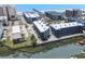 Aerial view showcasing the condo complex in relation to the beach and waterway, with visible parking and landscaping at 6001 N Ocean Blvd. # 137, North Myrtle Beach, SC 29582