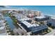 Aerial view of a large condo complex with a visible pool and waterway, highlighting its coastal location and community amenities at 6001 N Ocean Blvd. # 137, North Myrtle Beach, SC 29582