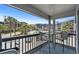 Relax on this cozy balcony with a view of palm trees and the community pool at 6001 N Ocean Blvd. # 137, North Myrtle Beach, SC 29582