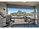 Enjoy a pool view from this balcony with outdoor seating and lush palm trees at 6001 N Ocean Blvd. # 137, North Myrtle Beach, SC 29582