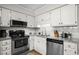 Lovely kitchen featuring stainless steel appliances, light granite counters and ample cabinet space at 6001 N Ocean Blvd. # 137, North Myrtle Beach, SC 29582