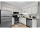 Charming kitchen with stainless steel appliances, light granite counters, and white cabinets at 6001 N Ocean Blvd. # 137, North Myrtle Beach, SC 29582