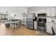 Open concept kitchen with stainless steel appliances connected to the dining and living area at 6001 N Ocean Blvd. # 137, North Myrtle Beach, SC 29582