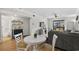 Bright living room with a slider to the balcony, dining area, and a bar with mini fridge at 6001 N Ocean Blvd. # 137, North Myrtle Beach, SC 29582