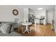 Bright living room adjacent to a modern kitchen with stainless steel appliances and a dining area at 6001 N Ocean Blvd. # 137, North Myrtle Beach, SC 29582