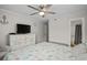 Bright main bedroom with a large bed and a decorative dresser at 6001 N Ocean Blvd. # 137, North Myrtle Beach, SC 29582