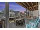 Enjoy neighborhood views from the spacious outdoor balcony with dining and lounge area at 6001-1010 S Kings Highway, Myrtle Beach, SC 29575