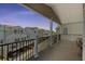 Enjoy neighborhood views from the spacious outdoor balcony with black metal railing at 6001-1010 S Kings Highway, Myrtle Beach, SC 29575