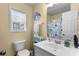 Bright bathroom features a vanity, toilet, and coastal-themed decor creating a relaxing atmosphere at 6001-1010 S Kings Highway, Myrtle Beach, SC 29575