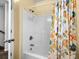 Full bathroom with a shower featuring a unique fish-themed shower curtain in a sunny aesthetic at 6001-1010 S Kings Highway, Myrtle Beach, SC 29575