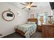 Cozy bedroom with a comfortable bed, ceiling fan, and nautical-themed decor at 6001-1010 S Kings Highway, Myrtle Beach, SC 29575