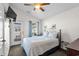 Bright bedroom with a comfortable bed, access to a balcony, and tasteful nautical decor at 6001-1010 S Kings Highway, Myrtle Beach, SC 29575