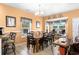 Charming dining area features a wooden table, seating for eight, and sun-filled windows at 6001-1010 S Kings Highway, Myrtle Beach, SC 29575