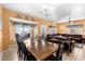 Spacious living area with a dining table, comfortable seating, and natural light from multiple windows at 6001-1010 S Kings Highway, Myrtle Beach, SC 29575