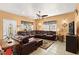 Spacious living room featuring a large leather sectional, tile floor, and ample lighting at 6001-1010 S Kings Highway, Myrtle Beach, SC 29575