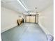 The garage interior features painted walls, a sealed floor, and lighting with an automatic door at 616 Mckinley Way, Conway, SC 29526