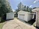 A detached garage and storage shed are on the property with a concrete driveway and mature trees overhead at 616 Mckinley Way, Conway, SC 29526