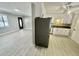 Open-concept kitchen with stainless steel appliances and elegant gray-toned flooring at 616 Mckinley Way, Conway, SC 29526