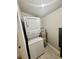 Convenient laundry area featuring a stacked washer and dryer set and modern water heater at 616 Mckinley Way, Conway, SC 29526