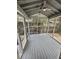 Relaxing screened porch with ceiling fan and serene views of the backyard at 616 Mckinley Way, Conway, SC 29526