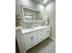 This bathroom features a double sink vanity with an illuminated mirror at 620 Bathurst Dr., Myrtle Beach, SC 29579
