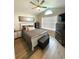 This bedroom features a ceiling fan, hardwood floors, neutral-colored walls, and ample storage at 620 Bathurst Dr., Myrtle Beach, SC 29579