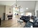 Open concept living room featuring a large leather sofa, fireplace, and barstool seating at 620 Bathurst Dr., Myrtle Beach, SC 29579