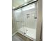 This is a full-glass shower with a built-in bench and mosaic tilework at 620 Bathurst Dr., Myrtle Beach, SC 29579