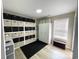 This storage room features a window and various storage shelves and wardrobes at 620 Bathurst Dr., Myrtle Beach, SC 29579