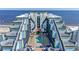 Aerial view of the building highlighting the rooftop pool, sun loungers, and nearby ocean at 6804 North Ocean Blvd. # 515, Myrtle Beach, SC 29572