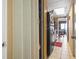 Hallway leading into the kitchen, featuring a storage closet and views into the living area at 6804 North Ocean Blvd. # 515, Myrtle Beach, SC 29572