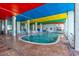 Indoor pool area featuring colorful ceilings and multiple seating areas for relaxation at 6804 North Ocean Blvd. # 515, Myrtle Beach, SC 29572