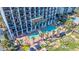 Aerial view of a beautiful outdoor pool area, complete with lush landscaping and lounge chairs at 6804 North Ocean Blvd. # 515, Myrtle Beach, SC 29572