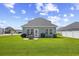 Expansive backyard with a well-maintained lawn, ideal for outdoor activities and enjoying the tranquil neighborhood at 715 Hobonny Loop, Longs, SC 29568