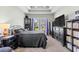 Bedroom with tray ceiling, ceiling fan, and furnishings at 715 Hobonny Loop, Longs, SC 29568