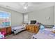 Bedroom featuring neutral walls, a ceiling fan, and two beds and a large dresser at 715 Hobonny Loop, Longs, SC 29568