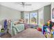 Cozy bedroom with ample natural light, comfortable furnishings, and charming decor, perfect for relaxation and rest at 715 Hobonny Loop, Longs, SC 29568