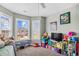 Bright and playful bedroom with natural light, cheerful decor, and a lovely view of the neighborhood at 715 Hobonny Loop, Longs, SC 29568