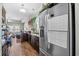 Well-equipped kitchen with dark cabinetry, stainless steel fridge, and open to the living area at 715 Hobonny Loop, Longs, SC 29568
