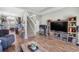 Spacious living room featuring wood floors, entertainment center, and an open floor plan at 715 Hobonny Loop, Longs, SC 29568