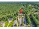 Overhead view of a building with parking surrounded by lush greenery in a neighborhood at 765 Shaftesbury Ln., Conway, SC 29526