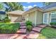 Landscaped backyard featuring a brick path and mature plantings at 765 Shaftesbury Ln., Conway, SC 29526