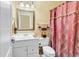 Bathroom featuring a vanity, decorative mirror, and a patterned shower curtain at 765 Shaftesbury Ln., Conway, SC 29526