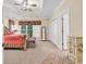 Primary bedroom with a decorative rug, full-length mirror, and ample closet space at 765 Shaftesbury Ln., Conway, SC 29526